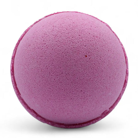 A round matte purple bath bomb with a textured surface from the set of 3 bath bombs very berry