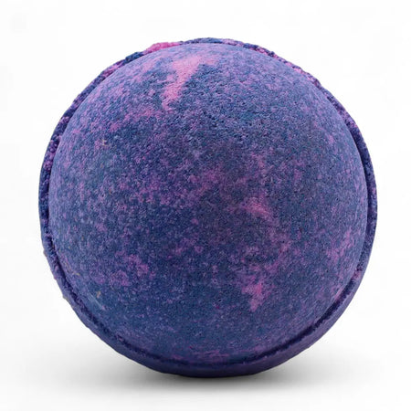 A spherical bath bomb with textured surface in swirling deep purple and pink from the yorkshire violet set of 3 bath bombs
