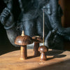 Set of 3 dark brown mango wood mushroom incense holders with smooth polished surfaces and natural wood grain detail