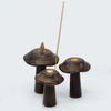 Set of 3 dark brown mango wood mushroom-shaped incense holders with gold-toned circular centers for flat cones