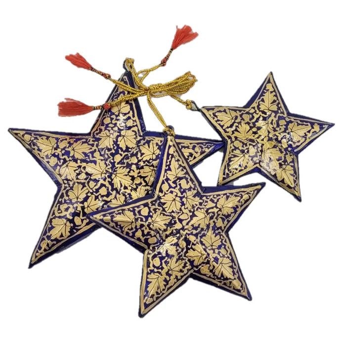 Set of 3 hand-painted papier maché stars in deep blue with gold leaf patterns and red tassels