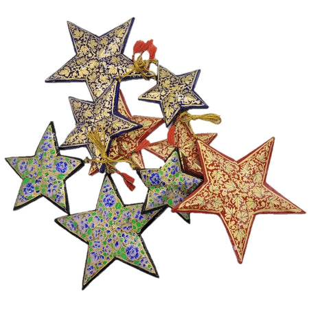 Set of 3 hand-painted papier maché star ornaments in vibrant colors with floral patterns and gold detailing and loops