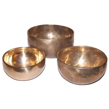 Set of 3 handmade brass singing bowls with warm golden interiors and matte exteriors offering high sound diameter x 5cm