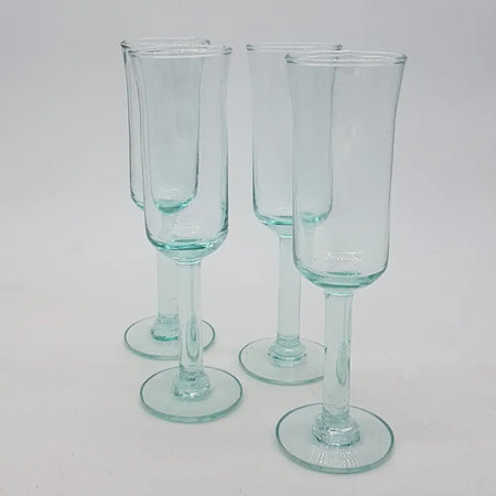 Set of four clear hand-blown recycled glass champagne flutes with slender stems and round bases 125ml capacity