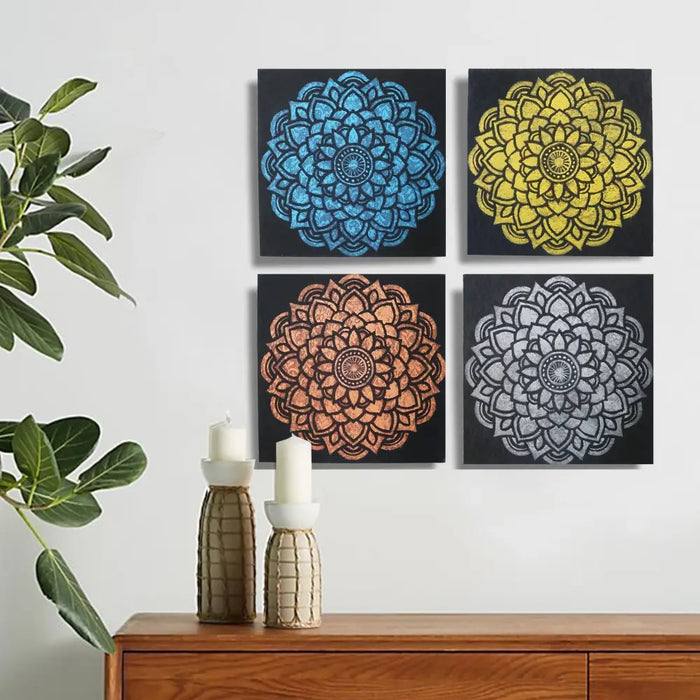 Set of 4 painted canvas wall art pieces with blue yellow copper and silver glitter mandala designs on black background