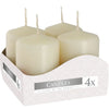 Four cream-colored pillar candles with smooth wax and thin wicks in a white patterned cardboard display box 40x60mm