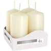 Set of 4 ivory cream-colored pillar candles with smooth wax and thin wicks in a white patterned display box