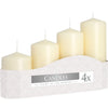 Set of 4 ivory pillar candles in varying heights displayed in a white zigzag-patterned box