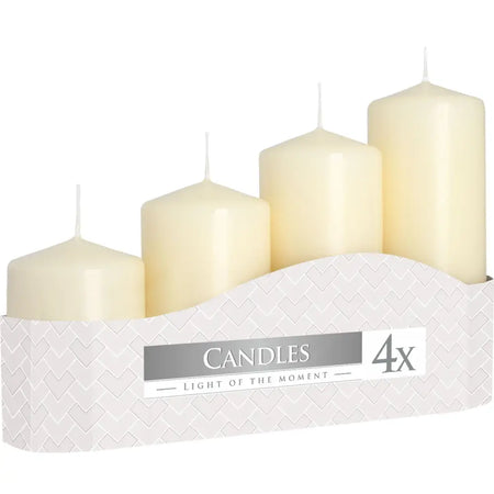 Set of 4 ivory pillar candles in varying heights displayed in a white zigzag-patterned box
