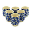 Set of six blue ceramic herbal tea cups with white and yellow daisy patterns for small herbal tea use