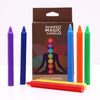Set of seven chakra manifest candles in vibrant purple blue orange green red and yellow colors made of wax