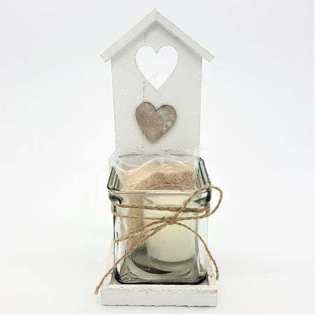 White wooden shabby chic beach hut tealight holder with heart cutout and glass jar candle with twine accent