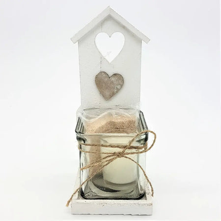 White wooden shabby chic beach hut tealight holder with heart cutout and glass jar candle with twine accent
