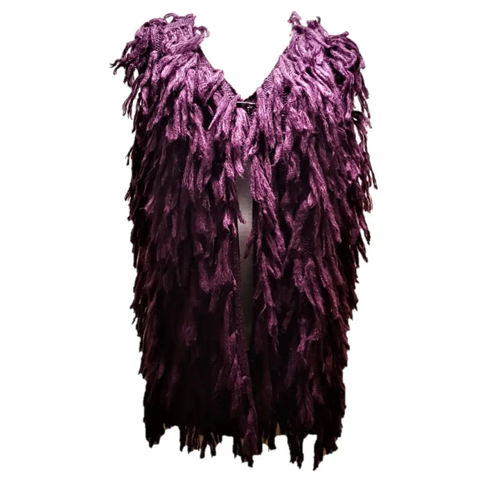 A deep purple fringed knit vest made of soft acrylic in a layered design shown as part of the three colours collection