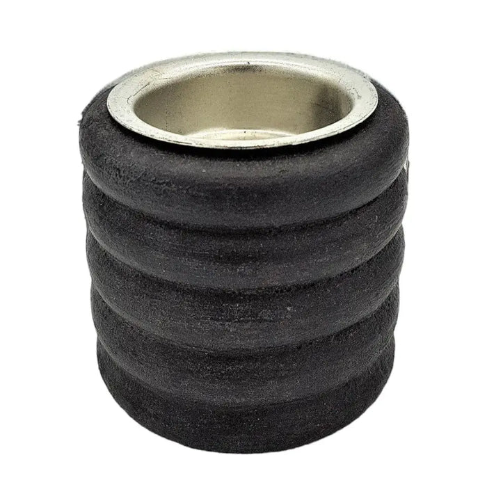 Black rubber grommet with metallic silver ring on a short ribbed wooden tealight holder for candle use