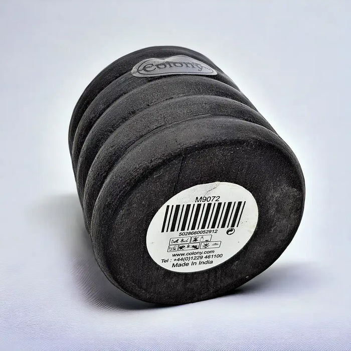 Black cylindrical short ribbed wooden tealight holder with white colony label and barcode made in india