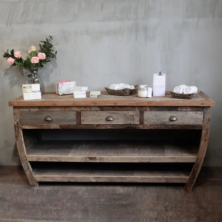 Rustic wooden sideboard unit with three drawers open shelving weathered wood finish and metal handles