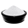 A black ceramic bowl filled with coarse white simmering granules for frankincense use