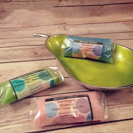 Lime green pear-shaped ceramic bowl with metallic rim holding simmering granules for mango flavor use