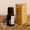 A dark amber glass bottle with black cap and white label of simmus essential oil blend containing ancient wisdom oil blend