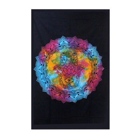 Vibrant rainbow tie-dye cotton bedspread with black hamsa hand mandala design used as wall hanging or bedspread