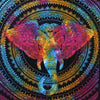 A vibrant cotton bedspread wall hanging with a rainbow elephant head design on a black background