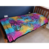 Vibrant tie-dye cotton bedspread wall hanging with psychedelic mandala design in pink blue yellow and purple shades