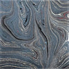 Single sheet handmade marbled gift wrap with swirling dark gray black and silver patterns and green gold accents