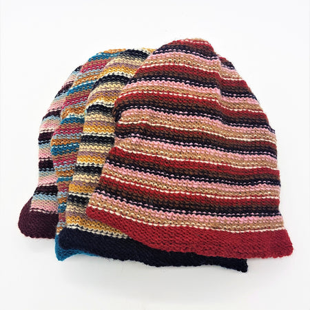 Slouchy wool beanie hat with bold red pink beige and navy stripes hand knitted for adults