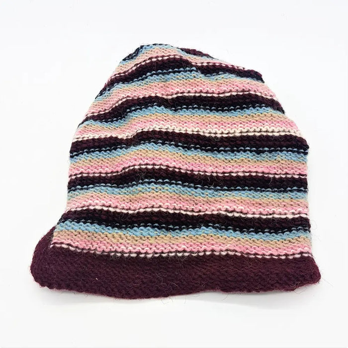 Slouchy wool beanie hat with hand-knitted soft pink blue and maroon stripes and a solid maroon ribbed brim