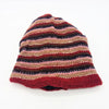 Slouchy wool beanie hat with hand knitted horizontal stripes in red pink brown and black with ribbed texture