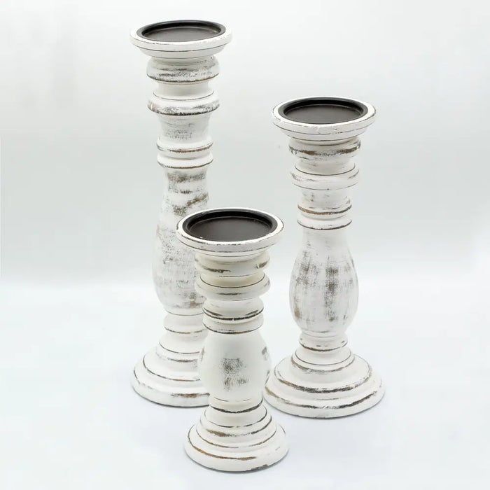 Three distressed whitewash mango wood candle stands with black inner rims for small candles or tealights