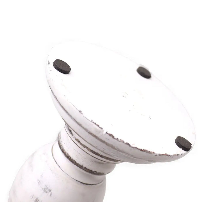 Small whitewashed mango wood candle stand with distressed finish and black rubber feet for stability