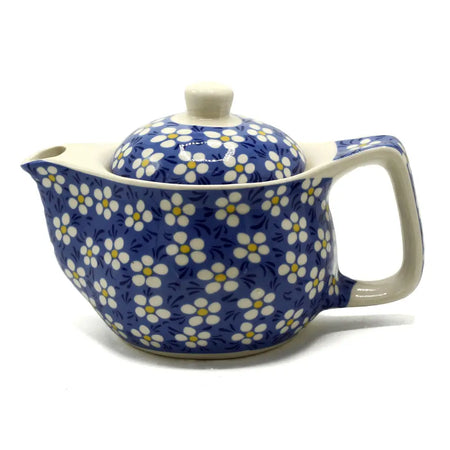 Small herbal teapot with a blue daisy ceramic body and cream handle for brewing herbal tea cups