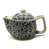 Cream-colored ceramic small herbal teapot with intricate navy blue floral and vine patterns for herbal tea cups