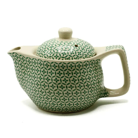Small herbal teapot made of cream ceramic with green mosaic geometric pattern and matching lid for herbal tea cups