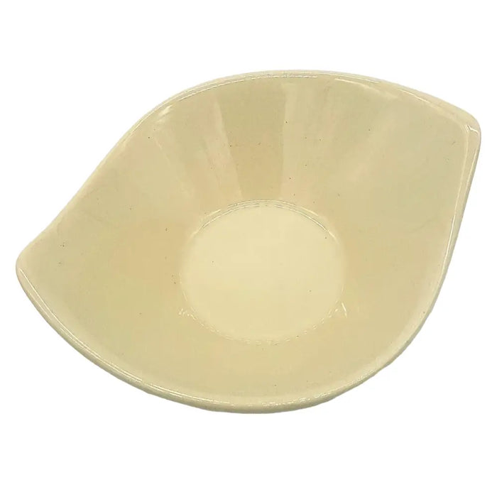 Small leaf-shaped ceramic plate in cream with a smooth glossy finish and an asymmetrical leaf-like shape