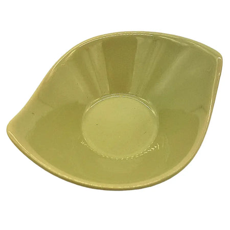 A small leaf-shaped ceramic plate in glossy olive green with smooth rounded edges and a unique design