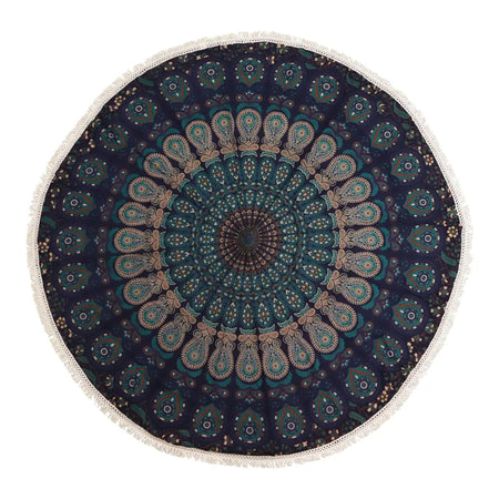 Dark blue cotton circular beach towel with teal and gold mandala patterns and white fringe border called peacock blues