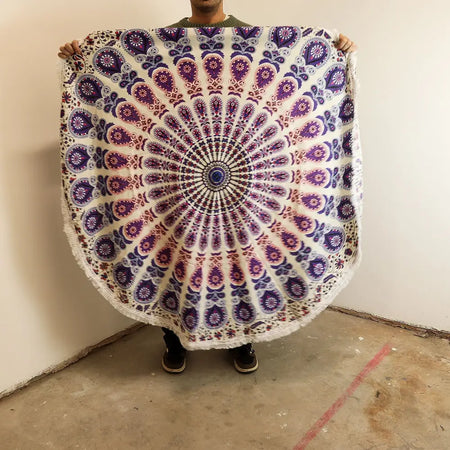 Small mandala roundie cotton blanket in peacock purples with white pattern and fringed edges measuring 130cm