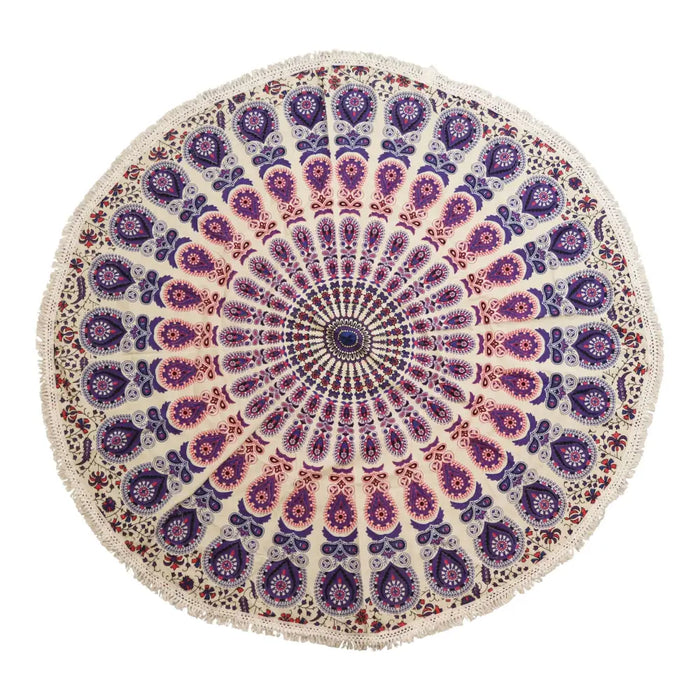 A cream cotton mandala beach towel with purple and pink paisley patterns and a dark blue center dot peacock purples design