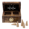 Small mango wood smoke box with dark wood incense burner gold-rimmed elephant emblem and light brown incense cones