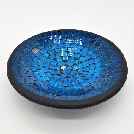 Small mosaic tile dish with vibrant blue glass tiles in concentric circles and a dark black rim