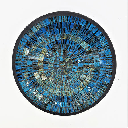 Small mosaic tile dish in blue with gold glitter featuring a circular mosaic design with concentric textured rings and dark border