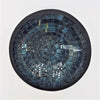 Small mosaic tile dish with circular dark blue and black glass mosaic rings in a matte black frame