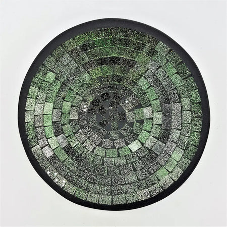 Small mosaic tile dish with circular green silver and black textured tiles in a sleek black frame