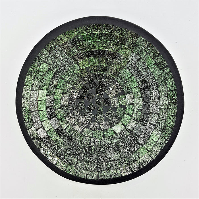 Small mosaic tile dish with circular green silver and black textured tiles in a sleek black frame