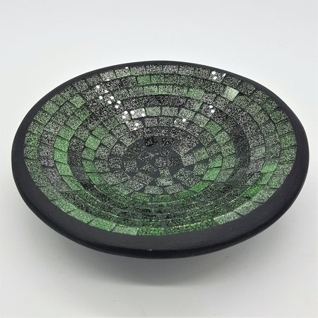 Small mosaic tile dish in green with concentric rings of glass tiles and a smooth black rim