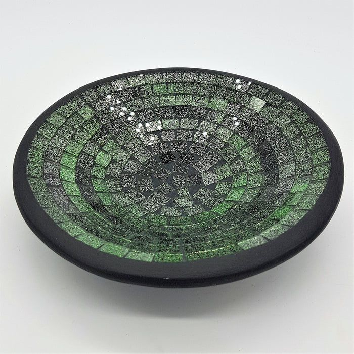 Small mosaic tile dish in green with concentric rings of glass tiles and a smooth black rim