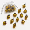 Small mouth-blown glass baubles in classic amber with ribbed heart star and acorn shapes and dark metal caps